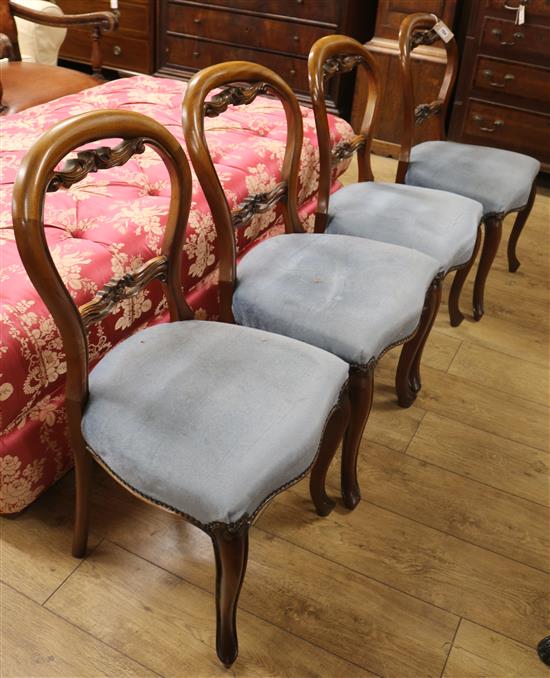 A set of four Victorian style balloon-back dining chairs